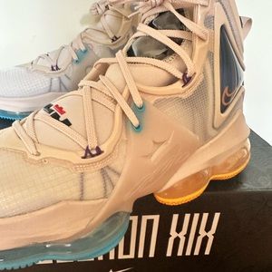 Brand new LeBron XIX.  Pearl white/University gold size 11 1/2.